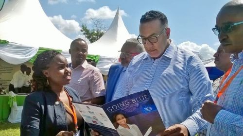 Blue Company Secretariat, Mary Waceke, presenting the anti-corruption initiative to the Cabinet Secretary for Tourism, Najib Balala, at the 17th Annual KAHC Symposium held on July 2019 at the Neptune Paradise Resort & Spa in Kwale County.