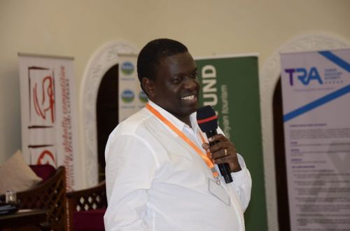 Regional CEO of Jubilee Holdings, Dr Julius Kipngetich, giving a speech at The 17th Annual KAHC Symposium held on July 2019 at the Neptune Paradise Resort & Spa in Kwale County.