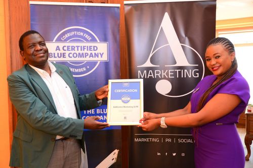 Addleston Marketing & PR Chief Executive Officer, Kendi Perpetual, receiving the Blue Company Certification from Executive Advisory Board Member of the Blue Company, Dr. Julius Kipngetich