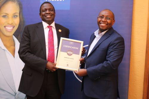 Sunworld Safaris Limited Head of  Human Resources, Julius, receiving the Blue Company Certification from Jubilee Holdings CEO/ Executive Board Member of the Blue Company, Dr. Julius Kipngetich