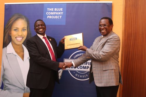 Polucon Services Kenya Chairman, Dominic Mathenge, receiving the Blue Company Certification from Jubilee Holdings CEO/ Executive Board Member of the Blue Company, Dr. Julius Kipngetich