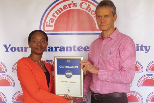 Farmers Choice Managing Director, James Taylor receiving the Blue Company Certification from UN Global Compact Network Kenya Coordinator Ms. Judy Njino