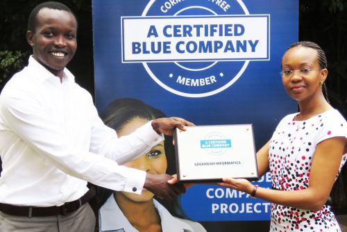Savannah Informatics Managing Director, John Muthee receiving the Blue Company Certification from UN Global Compact Network Kenya Coordinator Ms. Judy Njino