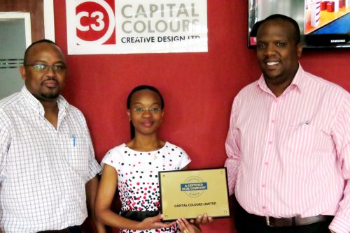 Capital Colours CEO, David Nene receiving the Blue Company Certification from UN Global Compact Network Kenya Coordinator Ms. Judy Njino