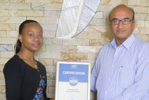 Premier Industries Limited CEO, Sadrudin Dharmarajan receiving the Blue Company Certification from UN Global Compact Network Kenya Coordinator Ms. Judy Njino