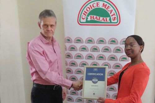Choice Meats Managing Director, James Taylor receiving the Blue Company Certification from UN Global Compact Network Kenya Coordinator Ms. Judy Njino