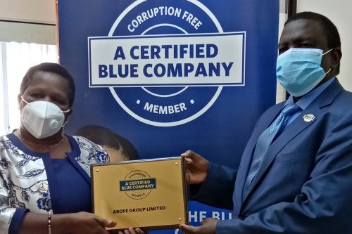 Arope Group Ltd Chief Executive Officer, Victoria Mulwa, receiving the Blue Company Certification from Executive Advisory Board Member of the Blue Company, Dr. Julius Kipngetich