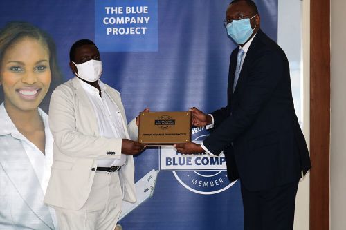 Kenbright Actuarial and Financial Services, Chief Executive Officer, Ezekiel Macharia, receiving the Blue Company Certification from Executive Advisory Board Member of the Blue Company, Dr Julius Kipngetich