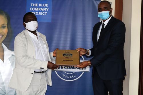 Vendeur Afrique, Director of Business Development and Strategy, Ronald Meru, receiving the Blue Company Certification from Executive Advisory Board Member of the Blue Company, Dr Julius Kipngetich